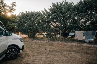 Off camper on campsite in France next to clothesline