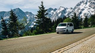 CamperBoy's camper is driving on a mountain road