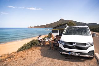 VW California Ocean camping on the beach in Greece