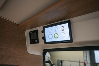 Touch panel in the interior of the Mooveo travell van for controlling light, temperature and electronics