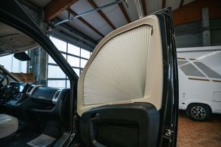 Fanned window screen for privacy in Mooveo van by CamperBoys