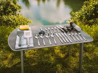 camping table with kitchen utensils