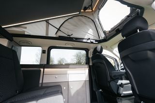 Inside the Pössl Campstar with open pop-up roof 